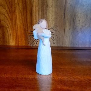 Angel figurine with dog.